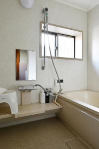 Kylpyhuone majoituspaikassa Yuzan apartment Sanjo