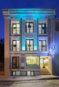 a white building with blue lights on it at OBAHAN HOTEL-Special Class in Istanbul