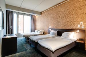 מיטה או מיטות בחדר ב-Comfort Hotel Kista