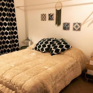 מיטה או מיטות בחדר ב-Torre's Camere & caffè