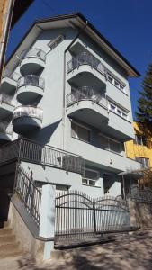 a building with balconies on the side of it at Apartment Esha in Sarajevo