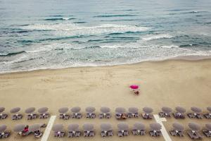 an overhead view of a beach with chairs and an umbrella at Ancora Resort in Acciaroli