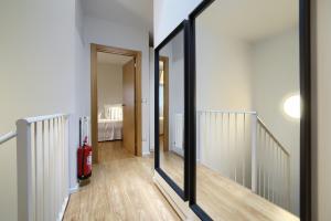 Łóżko lub łóżka w pokoju w obiekcie La Casa Gris