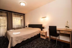 Krevet ili kreveti u jedinici u okviru objekta Hotel Faraon