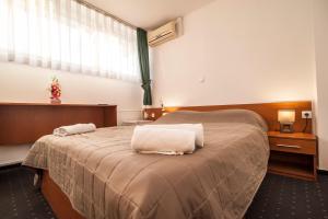 Krevet ili kreveti u jedinici u okviru objekta Hotel Faraon