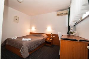 Krevet ili kreveti u jedinici u okviru objekta Hotel Faraon