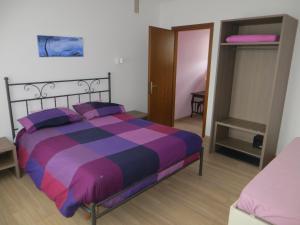 Postel nebo postele na pokoji v ubytování Agriturismo G.GARTROZ