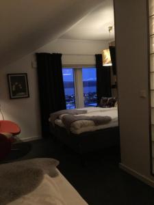 Postel nebo postele na pokoji v ubytování Breidablikk Guesthouse