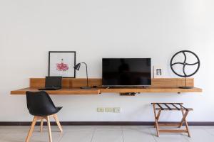 En tv och/eller ett underhållningssystem på Feel Buenos Aires Apartments