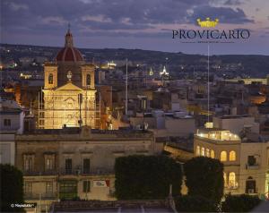 a view of a city at night with a building at Provicario in Victoria
