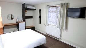 Afbeelding uit fotogalerij van Warrens Village Motel and Self Catering in Clevedon