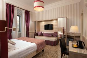 Tempat tidur dalam kamar di Hotel Nord Nuova Roma