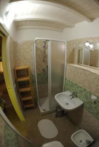 a bathroom with a shower and a sink at Siqillya in Ragusa