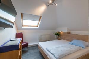 Ein Bett oder Betten in einem Zimmer der Unterkunft Hotel intakt
