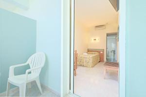 Postel nebo postele na pokoji v ubytování azuLine Hotel Pacific