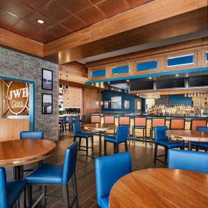 a restaurant with tables and chairs and a bar at Margaritaville Hotel Nashville in Nashville
