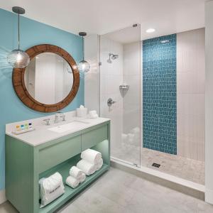 a bathroom with a sink and a shower at Margaritaville Hotel Nashville in Nashville