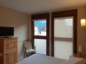 Cama o camas de una habitación en Hotel Alda A Boira
