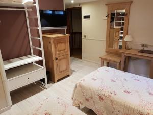 Cama o camas de una habitación en Hotel Alda A Boira
