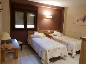 Cama o camas de una habitación en Hotel Alda A Boira
