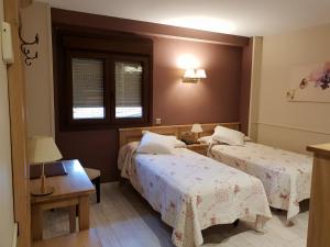 Cama o camas de una habitación en Hotel Alda A Boira