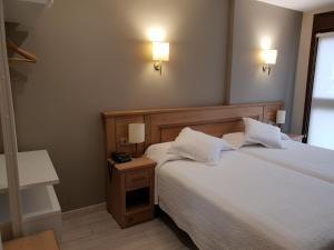 Cama o camas de una habitación en Hotel Alda A Boira