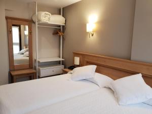 Cama o camas de una habitación en Hotel Alda A Boira