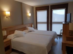 Cama o camas de una habitación en Hotel Alda A Boira