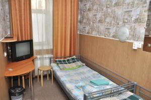 Un pat sau paturi într-o cameră la Grechesky-15 Guest house
