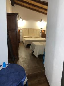 Postel nebo postele na pokoji v ubytování Antica Potecarìa