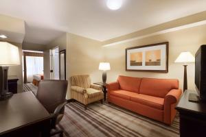 a living room with a couch and a chair at Country Inn & Suites by Radisson, Lexington, VA in Lexington