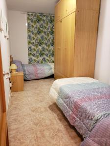 A bed or beds in a room at Can Joan Még 34 kép