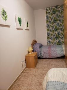 A bed or beds in a room at Can Joan