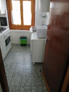 a small kitchen with a sink and a window at Cervinia in Breuil-Cervinia