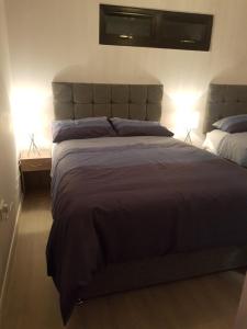 Katil atau katil-katil dalam bilik di Portglenone Garden Rooms