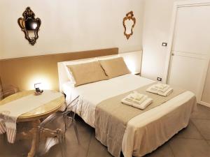 Postel nebo postele na pokoji v ubytování Il Sogno Torino Guesthouse