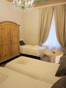 Postel nebo postele na pokoji v ubytování Il Sogno Torino Guesthouse