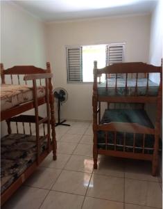 Postel nebo postele na pokoji v ubytování Chácara Recanto das Pedras - Socorro/SP - WiFi e Pebolim