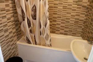 Koupelna v ubytování Orchidea Apartman Pécs + 14 fotografií