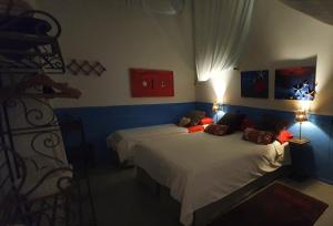Postel nebo postele na pokoji v ubytování Barrio Boutik Hostal long stays