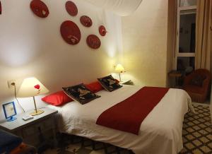 Postel nebo postele na pokoji v ubytování Barrio Boutik Hostal long stays