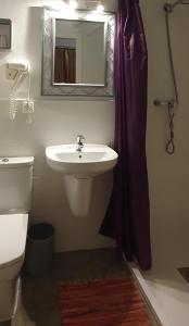 Koupelna v ubytování Barrio Boutik Hostal long stays