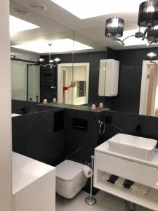 Kúpeľňa v ubytovaní Apartament Luksusowy z sauną