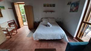 a bedroom with two beds in a room at Analipsi Sea View Villa in Pouríon