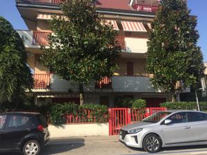 two cars parked in front of a building at due passi dal mare in San Benedetto del Tronto