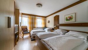 Posteľ alebo postele v izbe v ubytovaní Pension und Appartement Weinschreiber