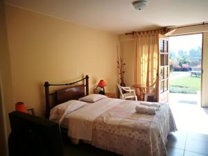 Postel nebo postele na pokoji v ubytování Las Cumbres INN