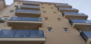 a building with solar panels on the side of it at Apartmani Venera in Belgrade