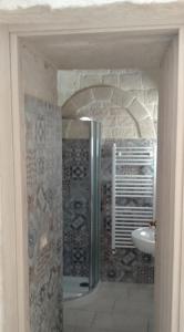 a bathroom with a shower and a sink at RITORNO AD ITACA in Locorotondo
