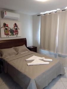 Ein Bett oder Betten in einem Zimmer der Unterkunft Flat Pipa Brisas do Amor